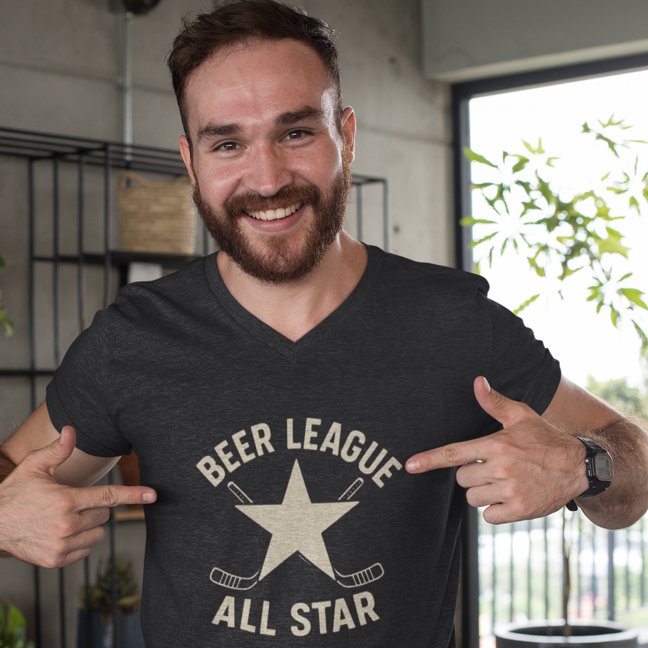 Playful moment between dad and son taking a selfie in matching hockey-themed shirts.