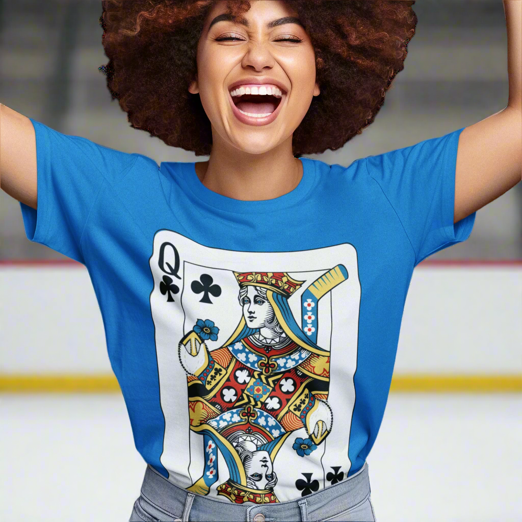 A young woman wearing a royal blue t-shirt with a hockey goalie themed, Queen of Clubs playing card design on a white background