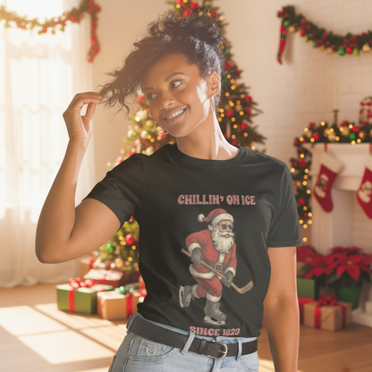 A woman wearing Chillin' on Ice Since 1823 shirt with Santa Claus skating with his red cap, black gloves and a pair of vintage ice skates