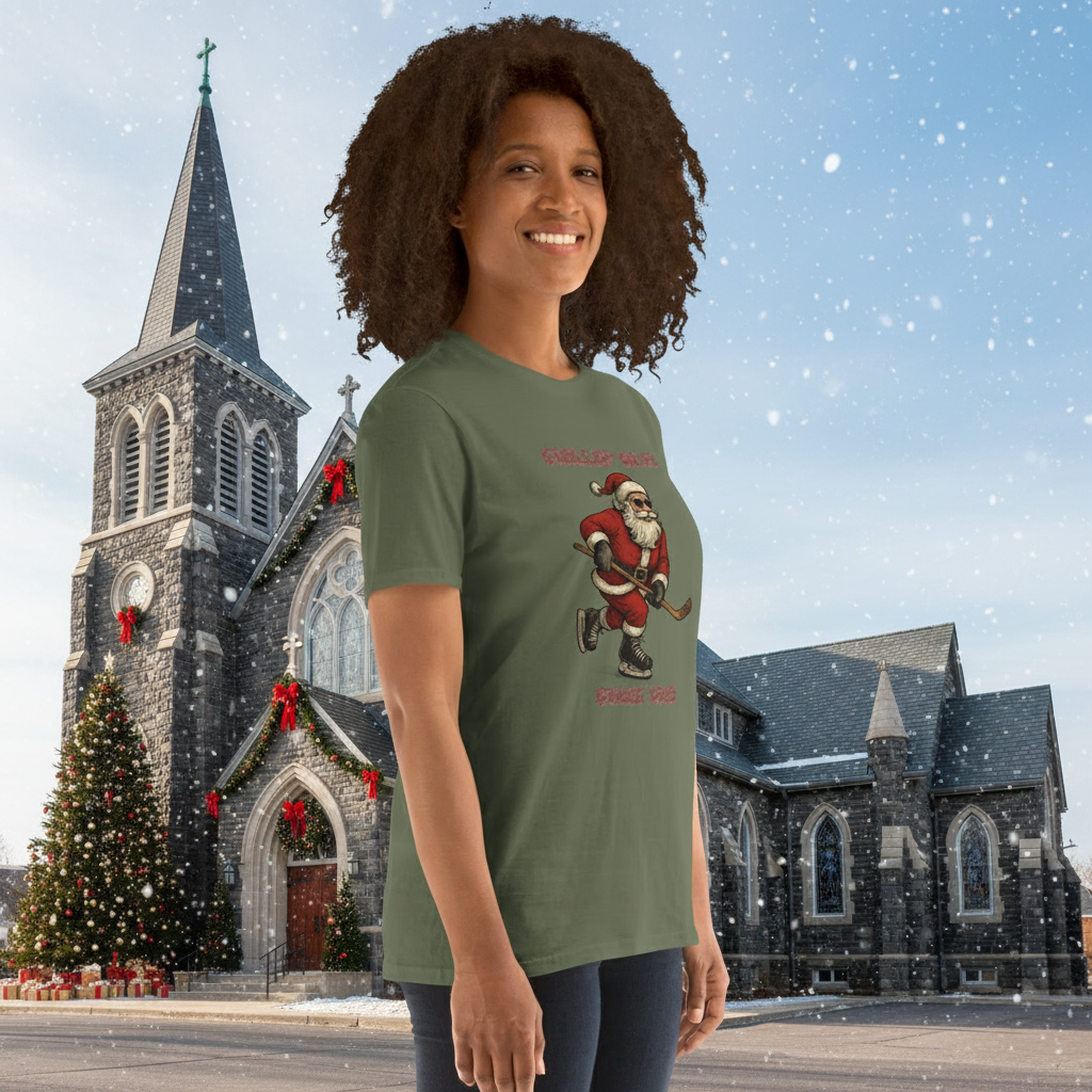 Person wearing a green t-shirt with a graphic of Santa Claus with his red suit, hockey stick and ice skates