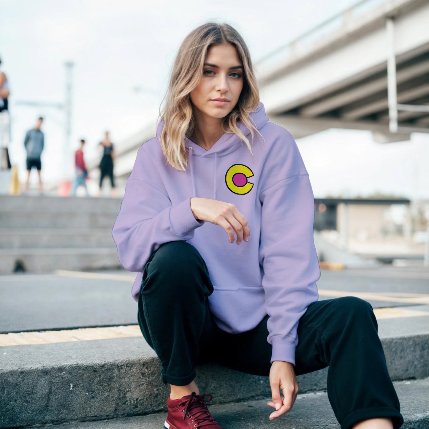 A woman wearing the Ice Queen Hoodie and a cold stare