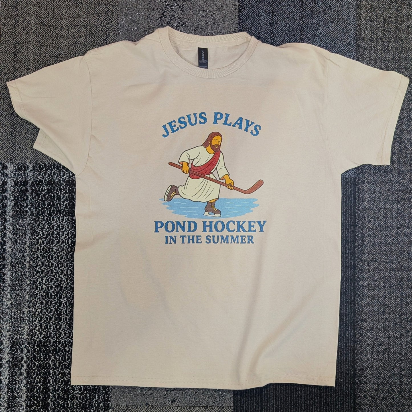 Jesus Plays Pond Hockey Tan T-Shirt – Humorous Summer Design