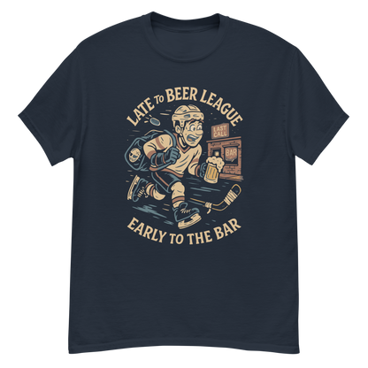 T-shirt with graphic print of a cartoon hockey player and text 'Late to Beer League, Early to the Bar'.