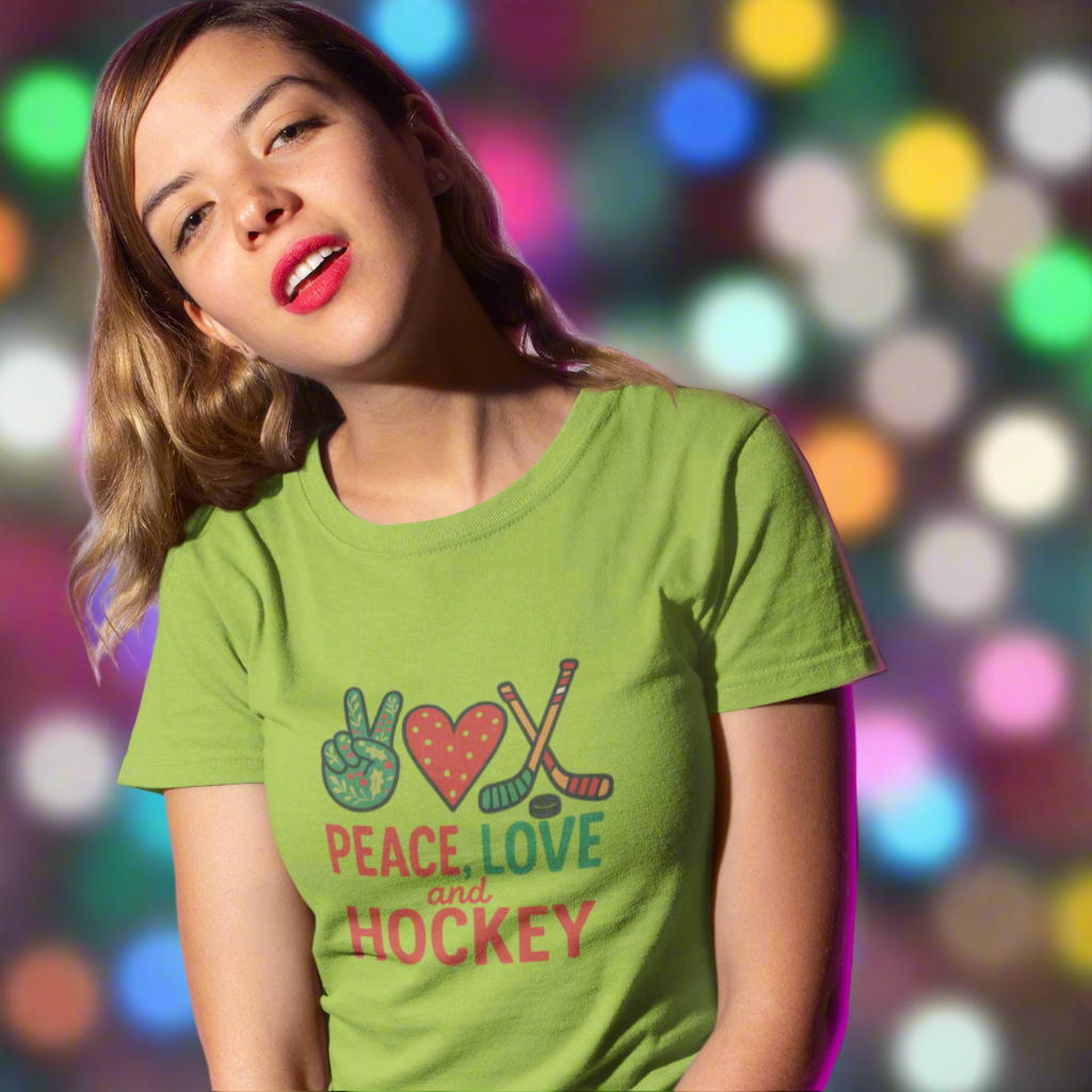 Woman wearing a green t-shirt with 'Peace Love Hockey' Christmas design against a purple background