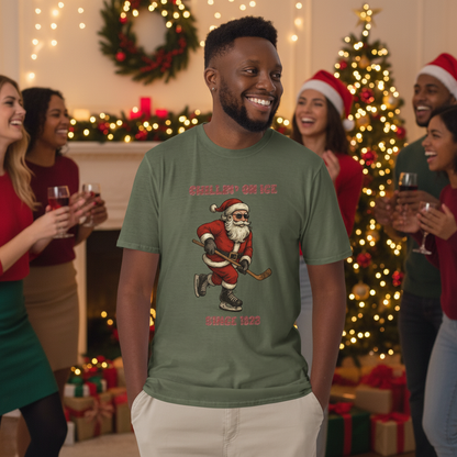 Man wearing a green t-shirt with a graphic of Santa Claus playing hockey on an outdoor hockey rink