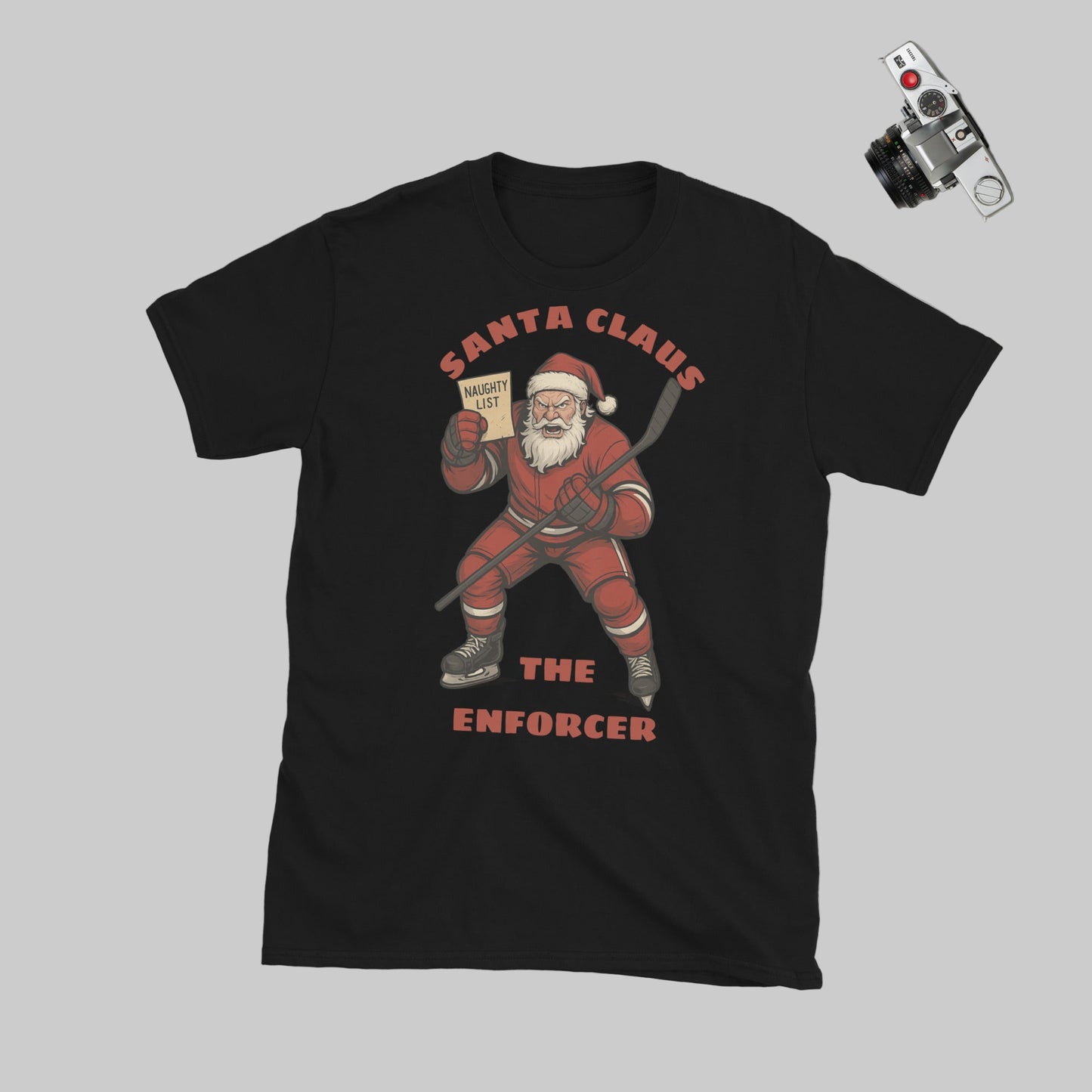A black T-shirt featuring Santa Claus looking mad and ready to Enforce the naughty list