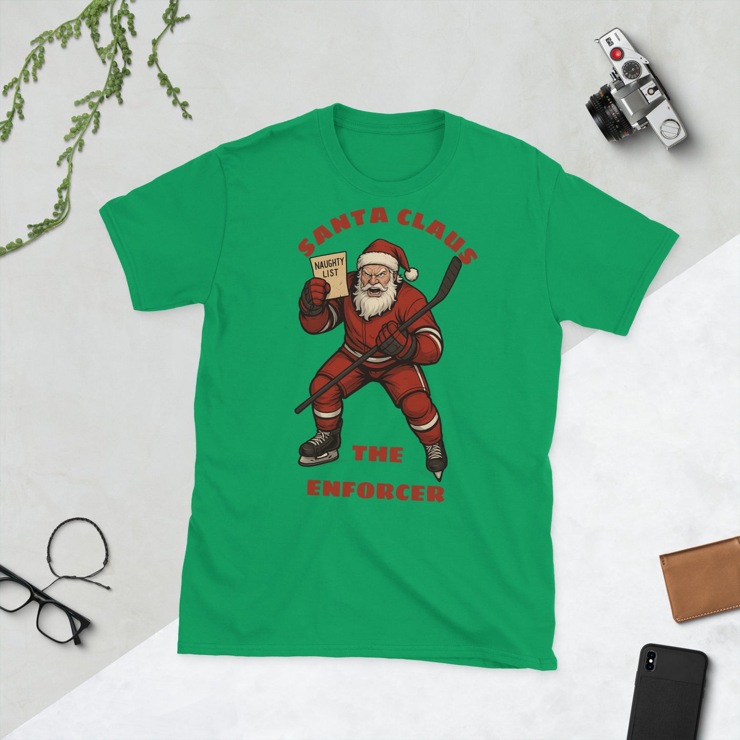 A green T-shirt with an angry Santa Clause holding up the naughty list.