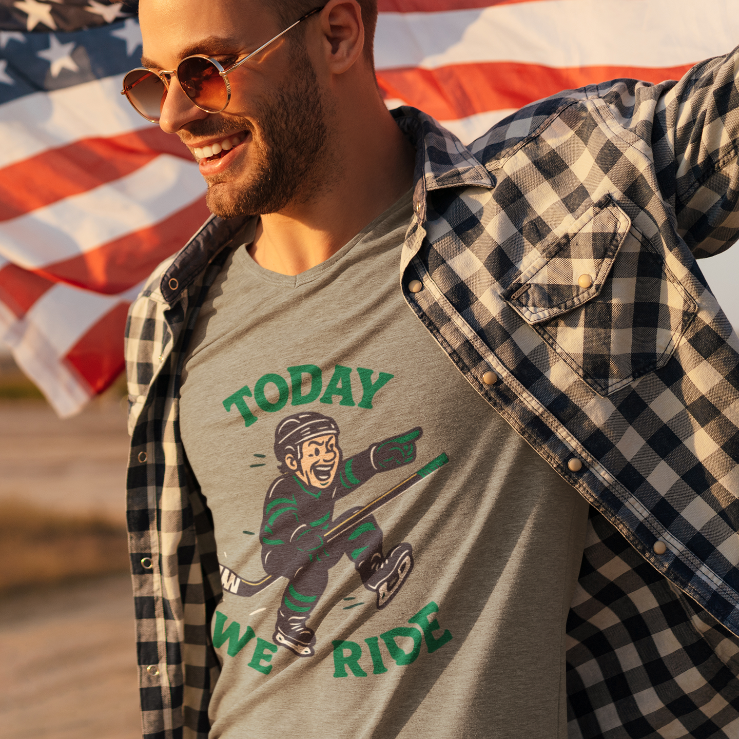 A man wearing a t-shirt with logo of a goal celebration and the text, "Today we Ride"